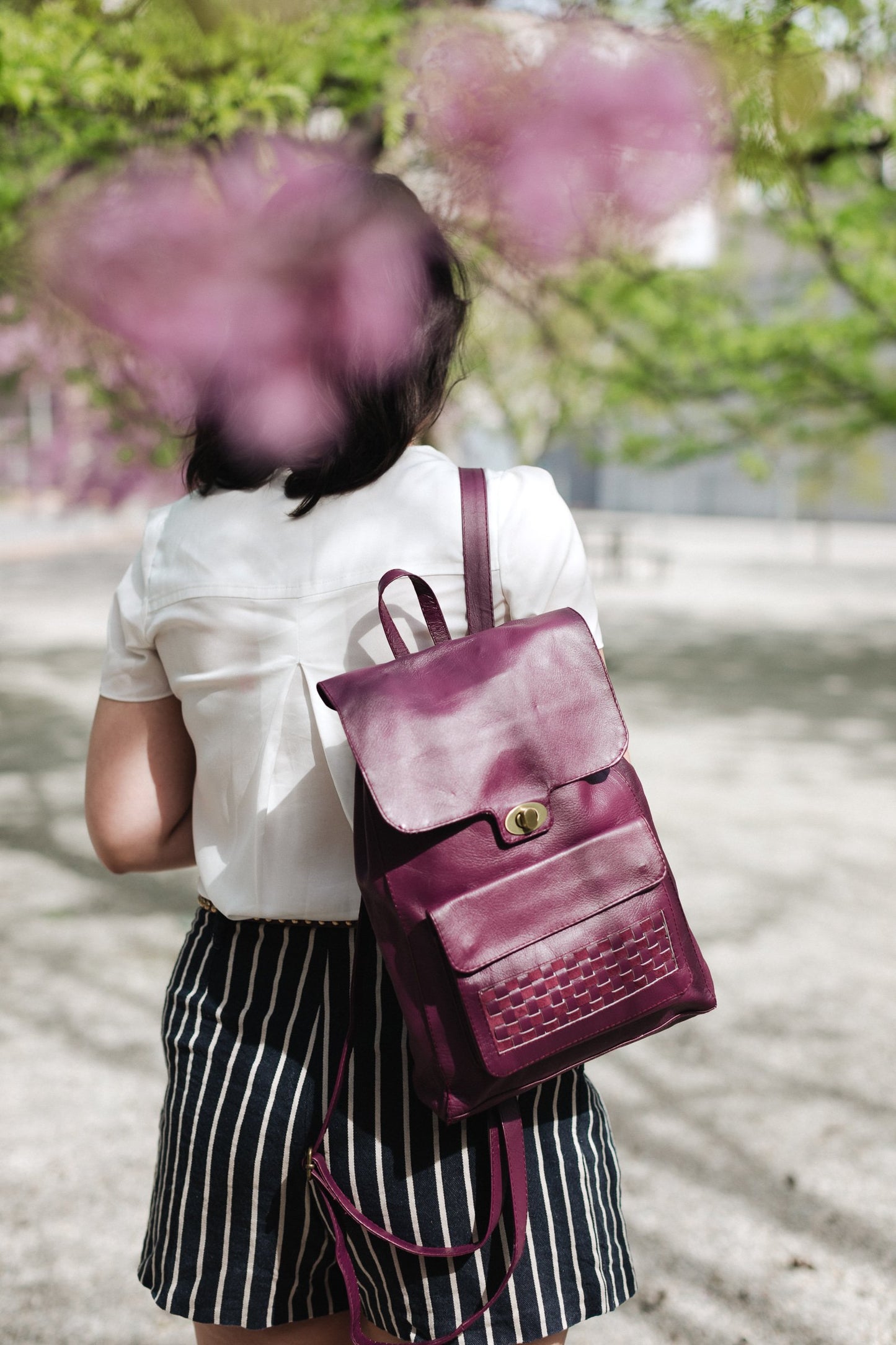 MAGENTA LEATHER BACKPACK WITH WOVEN ACCENT ON FRONT POCKET